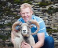 Adam Henson with a North Ronaldsay ram