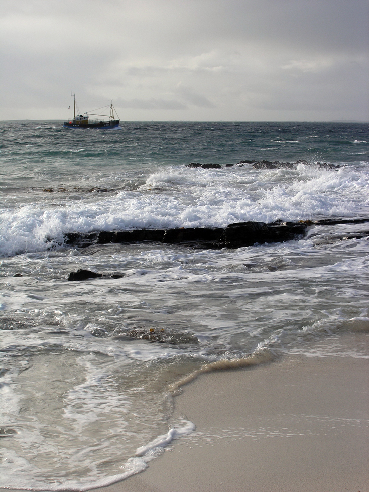 North Ronaldsay fishing boat and sea.Photograph © SelenaArte